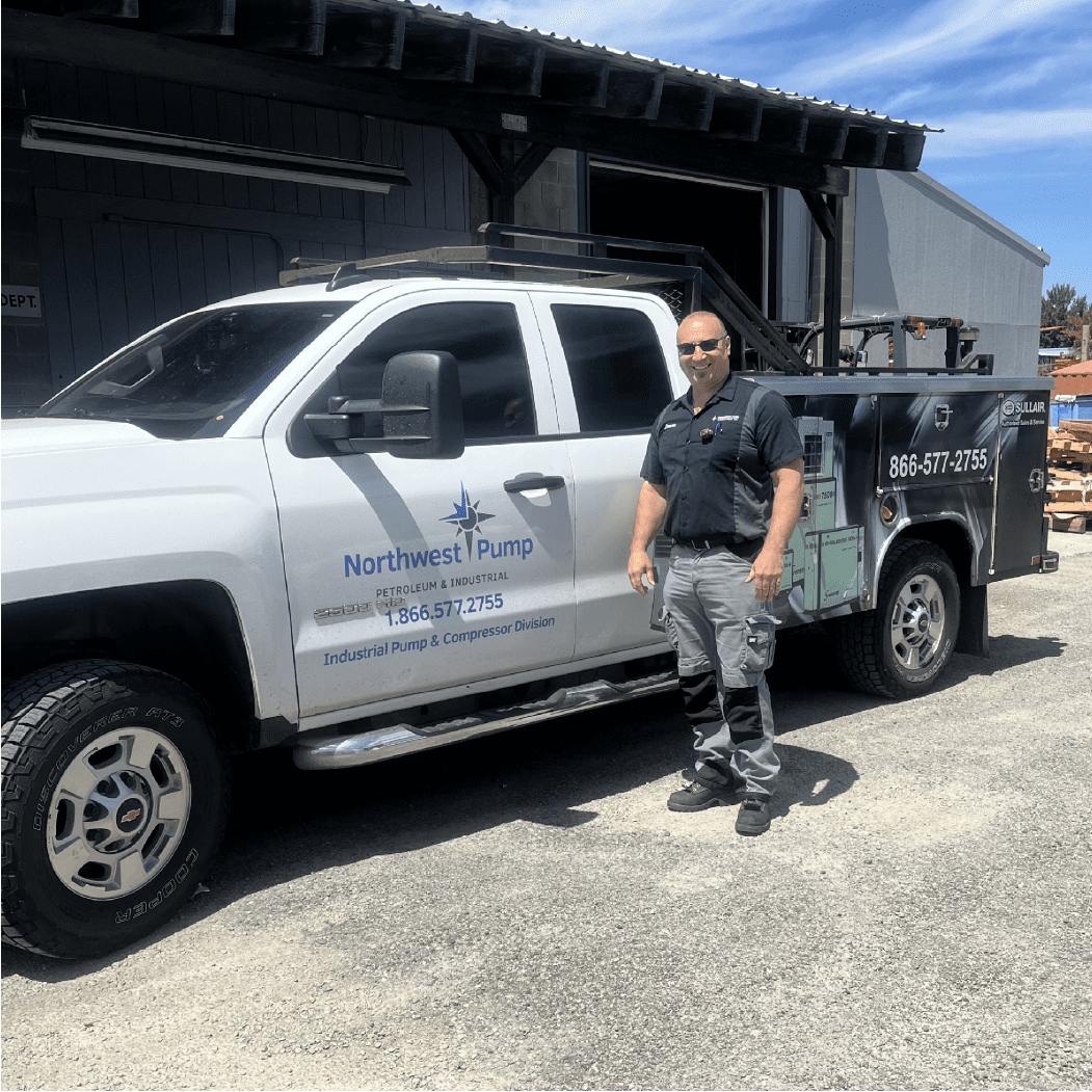 Spokane NW Pump engineer next to his work truck